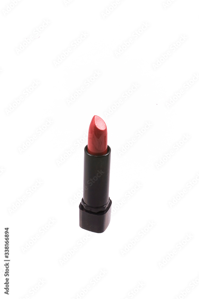 red lipstick in a black body on a white isolated background red lipstick in a black body on a white isolated background
