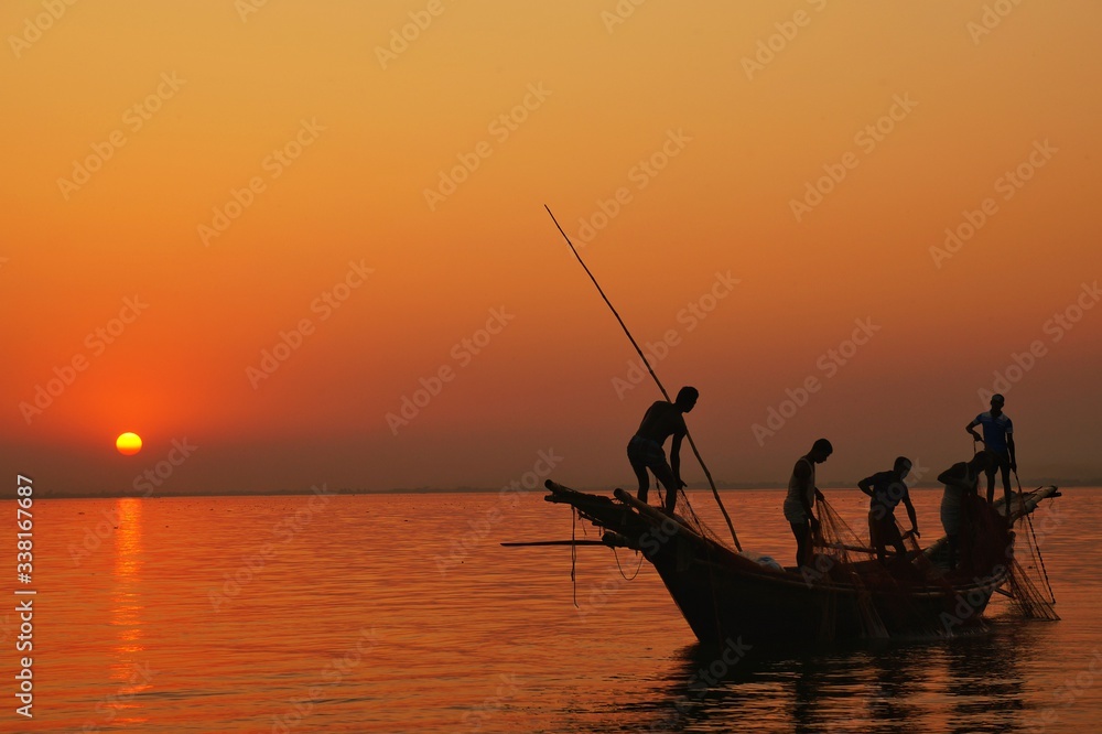 fishing at sunset