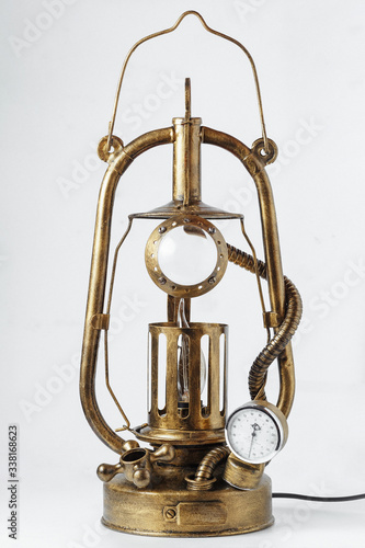 fantastic product in steampunk style, table lamp with from a kerosene lamp with additional valves on a white background