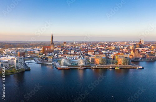 panorama of the city of rostock - aerial view over the river warnow  skyline during sunrise