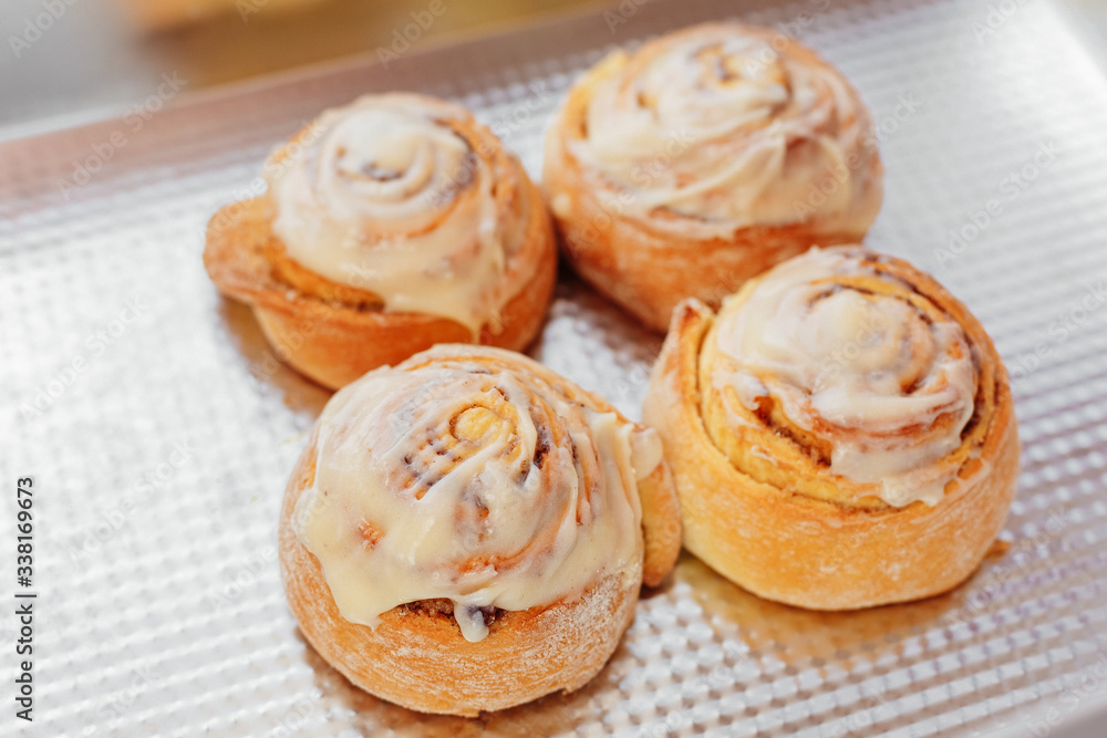 Stack of freshly cinnabon, French buns with cinnamon and cream