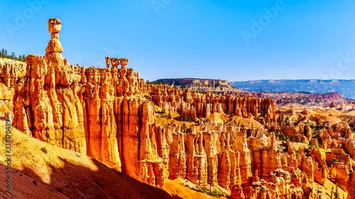 Sunrise over the Vermilion colored Pinnacles, Hoodoos and Amphitheaters along the Navajo Loop Trail in Bryce Canyon National Park, Utah, United States