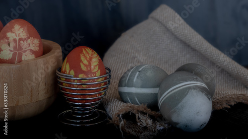 Traditional easter eggs on dark background and rustic cloth