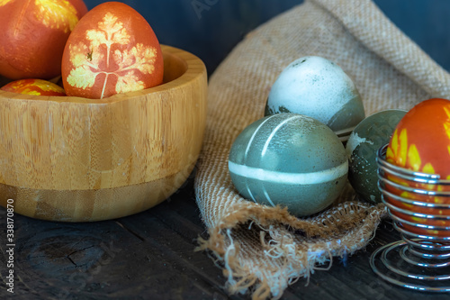 Traditional easter eggs on dark background and rustic cloth