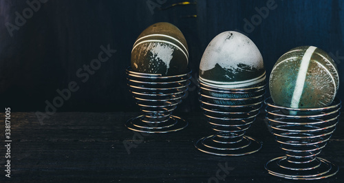 Traditional easter eggs on dark background and rustic cloth