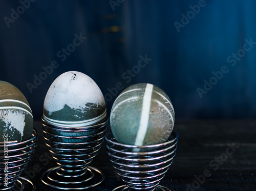 Traditional easter eggs on dark background and rustic cloth
