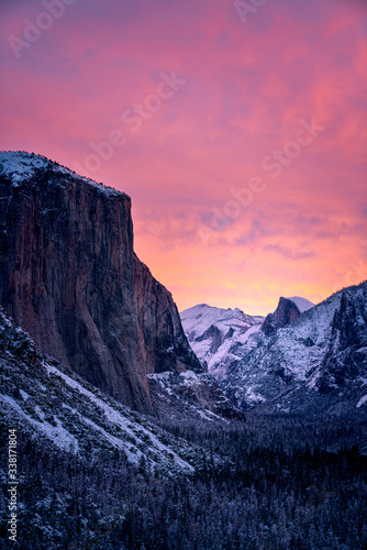 Dramatic sunset over snowy mountains in winter