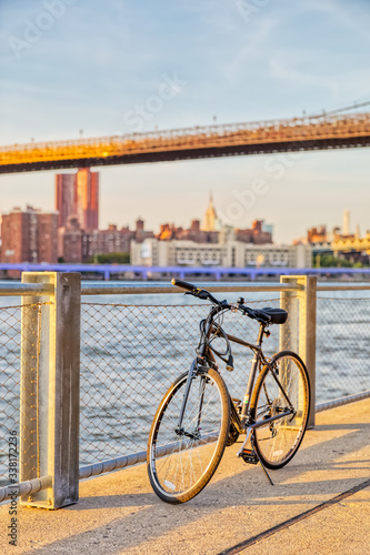 Bicycle in front of the Brooklyn Bridge Park fence and Manhattan panorama