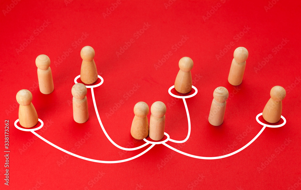 Obraz premium Concept of infidelity and betrayal (treason) in family or married couple. Wooden figures with lines as symbol of the relationship between man and woman on red background.