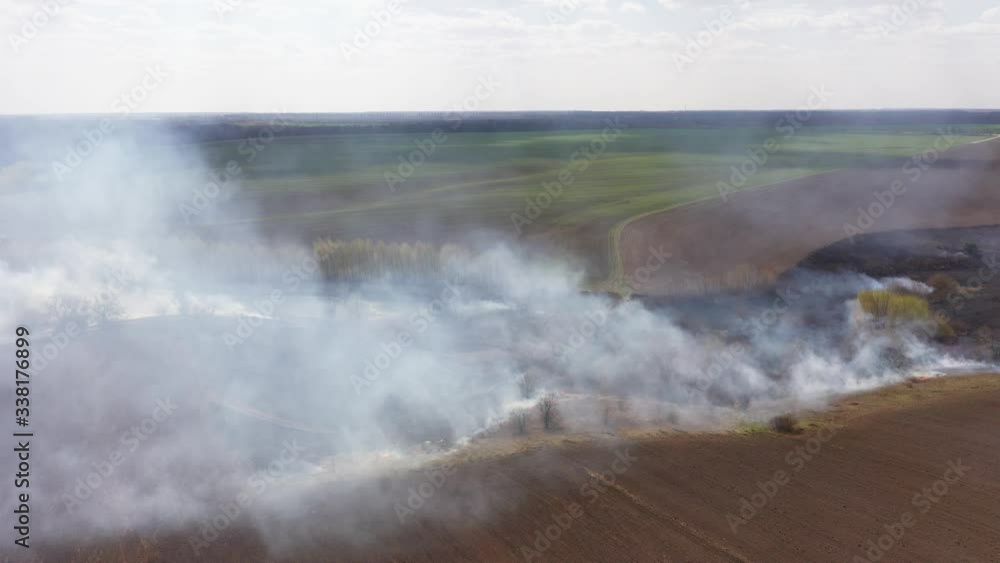 Aerial View of Big Smoke Clouds and Fire on the Field Aerial View of Big Smoke Clouds and Fire on the Field