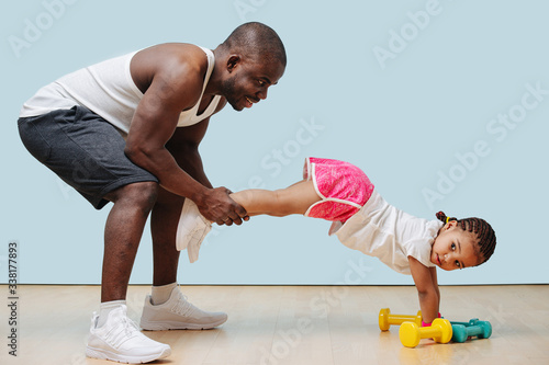 Father and daughter are working out during covid-19 shutdown