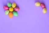 Easter eggs in the shape of a flower on a purple background