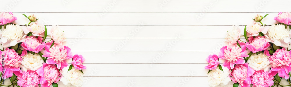 Floral banner. Beautiful pink and white peonies on white wooden background. Birthday, Valentines Day, Happy Mother's day or Women's day concept. Top view, copy space. Floral banner. Beautiful pink and white peonies on white wooden background. Birthday, Valentines Day, Happy Mother's day or Women's day concept. Top view, copy space.