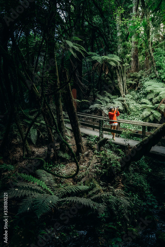 7/3/2020 Asian woman take pictures inside Mitai Maori Village, New Zealand.