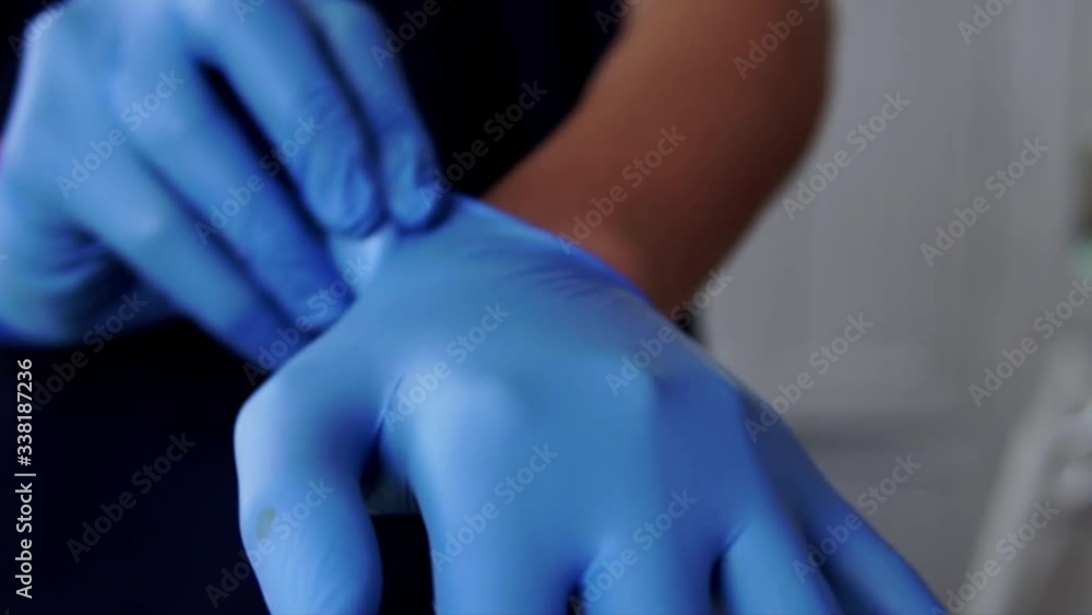 Hands of a boy squeezing cologne from a spray bottle in his hands Hands of a boy squeezing cologne from a spray bottle in his hands