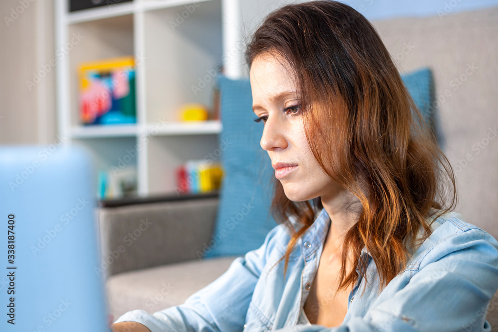 Woman working at home on a laptop computer. Home office Woman working at home on a laptop computer. Home office
