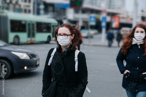 People with face masks in the city street