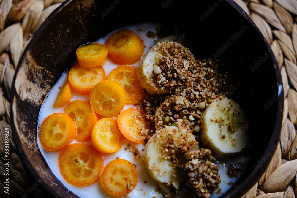 Healthy snack, yoghurt with kumquat, granola, banana Healthy snack, yoghurt with kumquat, granola, banana