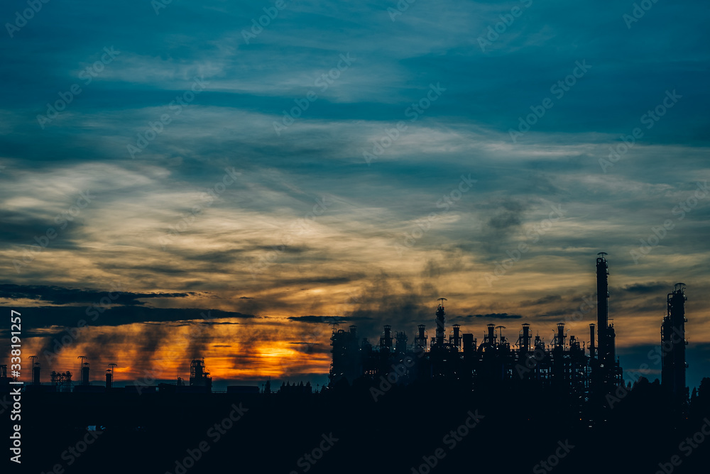 Long exposure image of Refineries oil plant Taken in the twilight,Thailand,Concepts of energy and environment,Oil Industry - refinery factory,copy space
