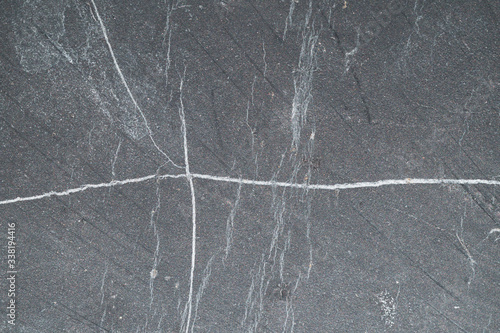 Carbon stone gray texture. scratched surface. geological background