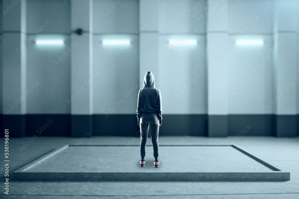 Fototapeta premium Back view of hacker abstract illuminated concrete interior