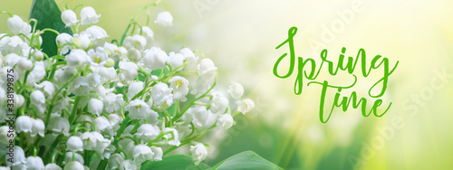 Lily of the valley (Convallaria majalis), blooming spring flowers in the form of postcard with greeting text, closeup, banner