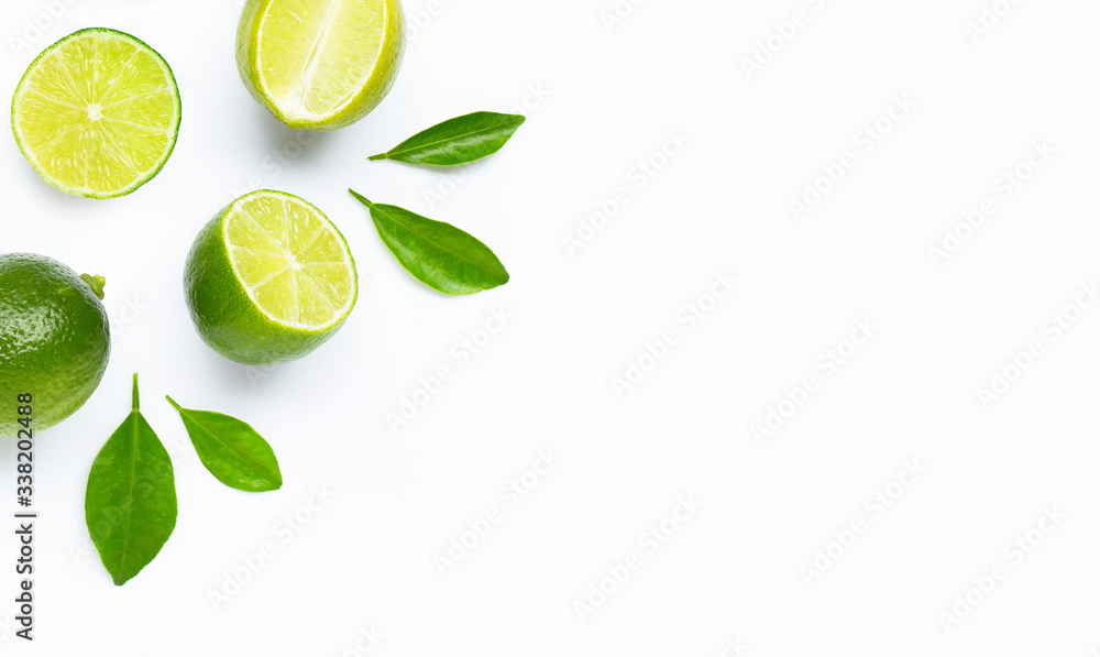 Limes with leaves isolated on white background. Limes with leaves isolated on white background.