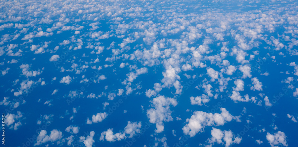 small cirrus clouds high in the blue sky small cirrus clouds high in the blue sky