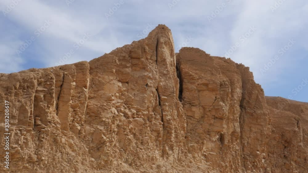 Scenic View of a High Rocky Mountain of Brown Color in the Desert Not Far From the Valley of Pharaohs in Egypt. Scenic View of a High Rocky Mountain of Brown Color in the Desert Not Far From the Valley of Pharaohs in Egypt.