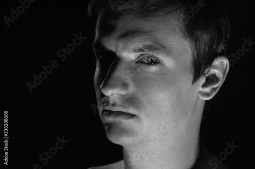 black and white dramatic portrait of a guy © Serhii  Holdin