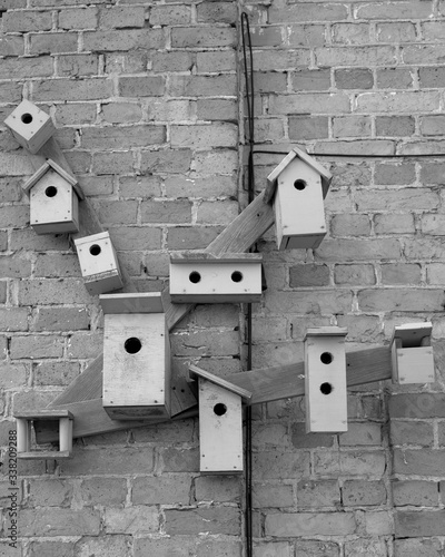 red brick wall with bird houses
