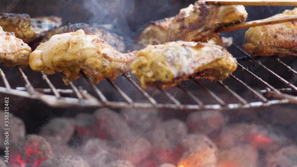 Delicious curry marinated chicken legs on the grill. Delicious curry marinated chicken legs on the grill.
