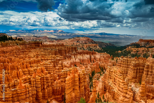 Bryce canyon national park with dramatic cloudy sky in backdrop, Utah. Vibrant rock formations "Hoodoos" and a dramatic cloudy sky.