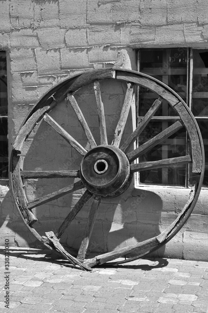 old wagon wheel in black and white