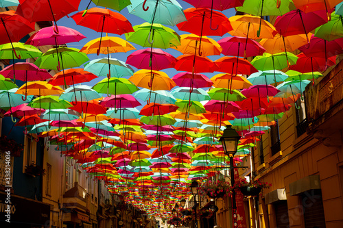 colorful umbrellas in the middle of the street