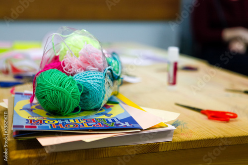 balls of threads of different colours, scissors, glue, set for children's art