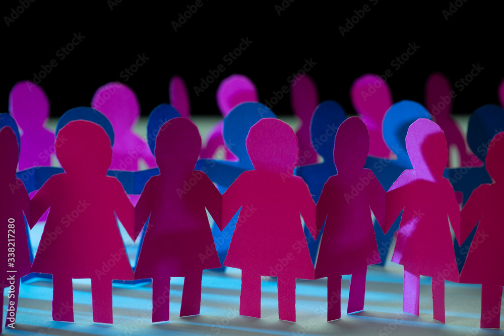 paper-dolls-holding-hands-symbolizing-union-and-team-stock-photo