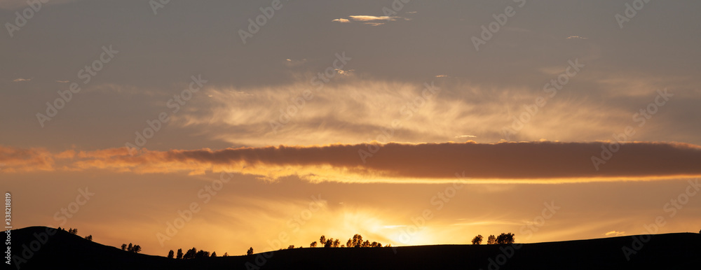 Bronzed sunset in the mountains, panorama landscape, natural backgrounds