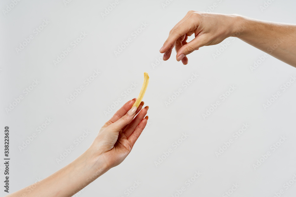 female hand holding a pencil female hand holding a pencil
