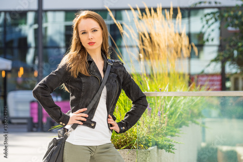 Fashion woman in city wearing romenes jacket. photo