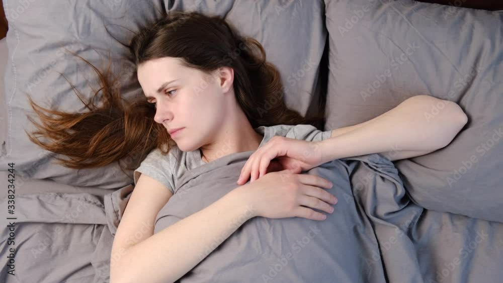 Close up of sad thoughtful insecure young woman cover face with hands, suffers from migraine or depression, stressed frustrated anxious lady doubting deciding troubled with grief sorrow concept. Close up of sad thoughtful insecure young woman cover face with hands, suffers from migraine or depression, stressed frustrated anxious lady doubting deciding troubled with grief sorrow concept.