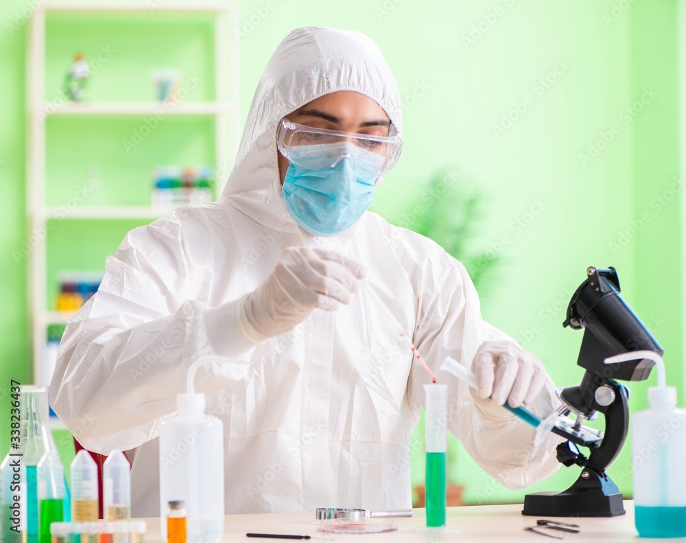 Chemist working in the lab on new experiment Chemist working in the lab on new experiment