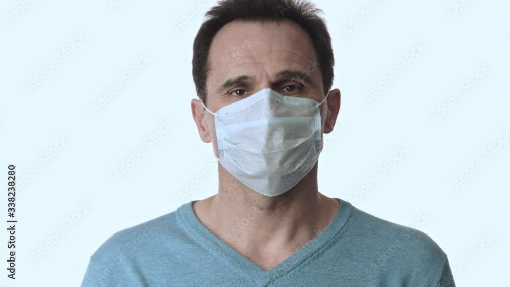 Man takes off medical mask, takes deep breath. Coronavirus hotspots. Lockdown Man takes off medical mask, takes deep breath. Coronavirus hotspots. Lockdown