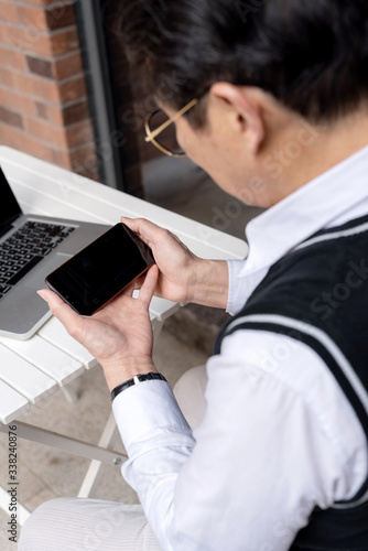 Asian seniors using computers photo