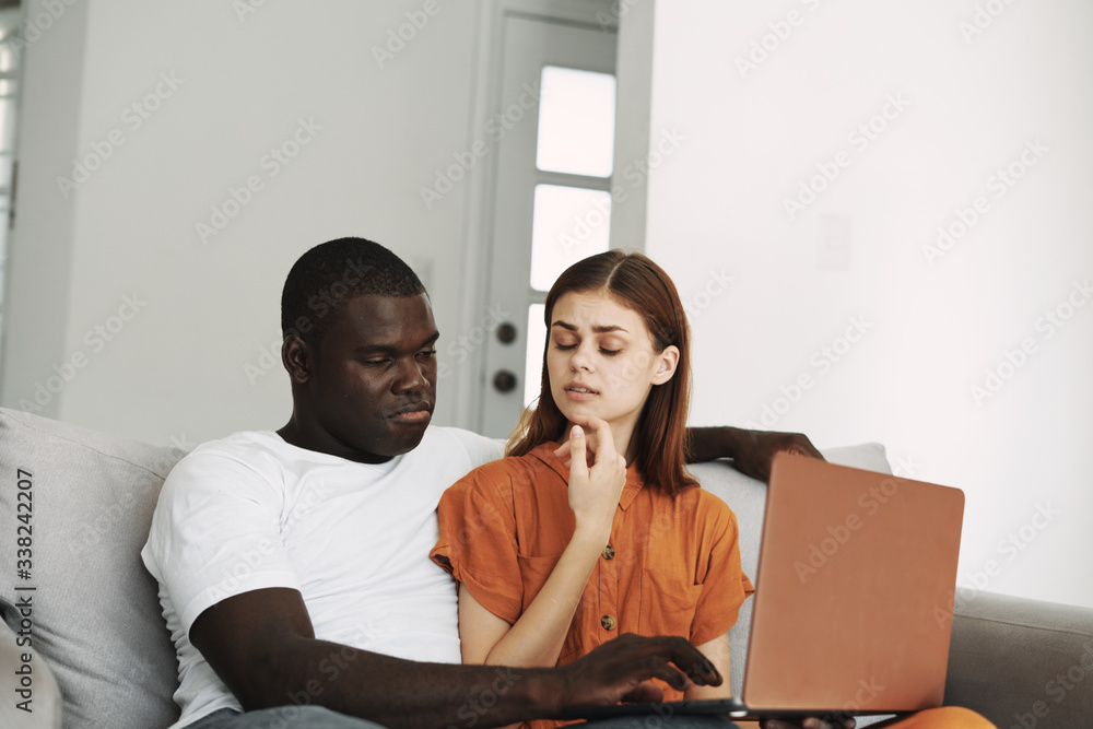 hispanic couple using laptop hispanic couple using laptop