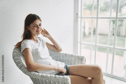 young woman sitting on a chair