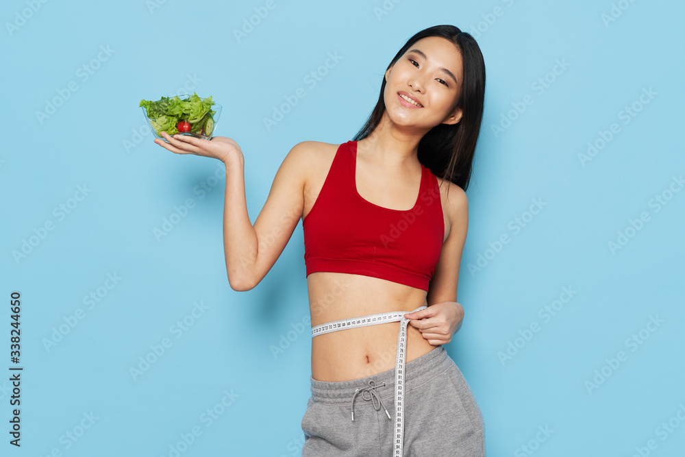 young woman with a measure tape young woman with a measure tape