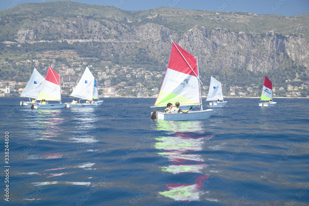 Fototapeta premium Children in sailing school in port at Saint Jean Cap Ferrat, French Riviera, France