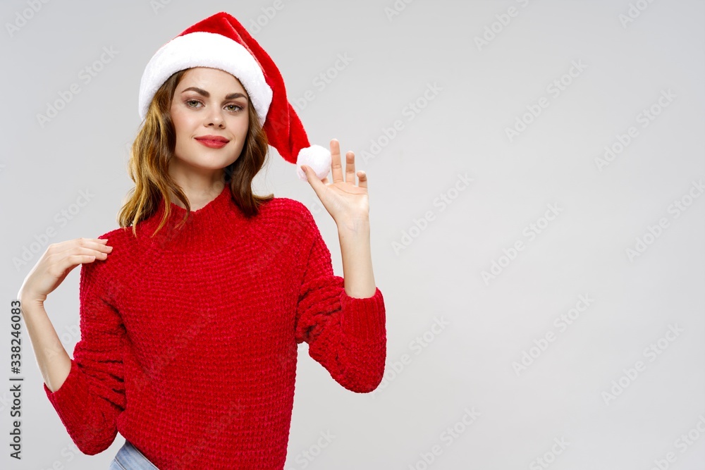young woman in santa hat young woman in santa hat
