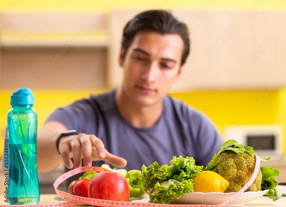Young man in dieting and healthy eating concept Young man in dieting and healthy eating concept